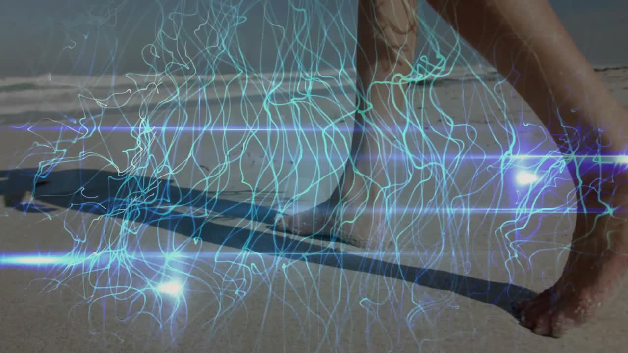 Woman pressing bare foot into wet sand at shoreline activating animated blue network for gait test
