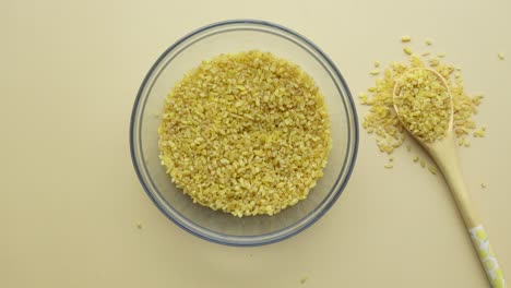 bulgur in a bowl and spoon