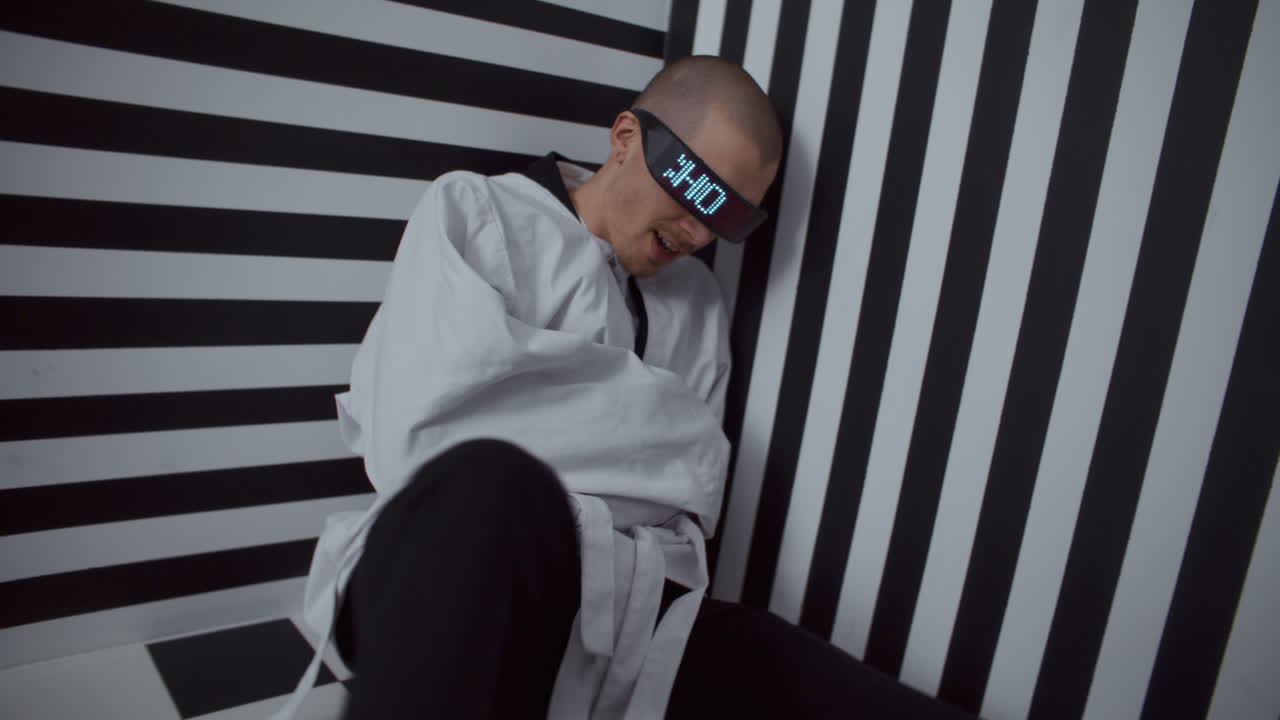 Man in Restraints with Digital Glasses