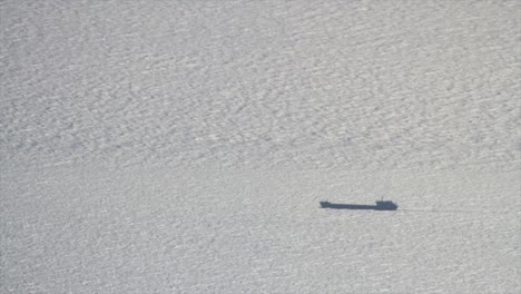 ship's shadow on a calm sea