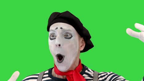 mime character with imaginary ball on a green screen, chroma key