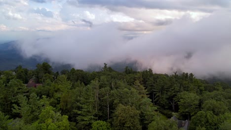 treetop aerial view of clouds and fog over mountains near blowing rock nc