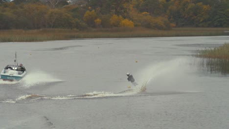 water skier rounding buoy