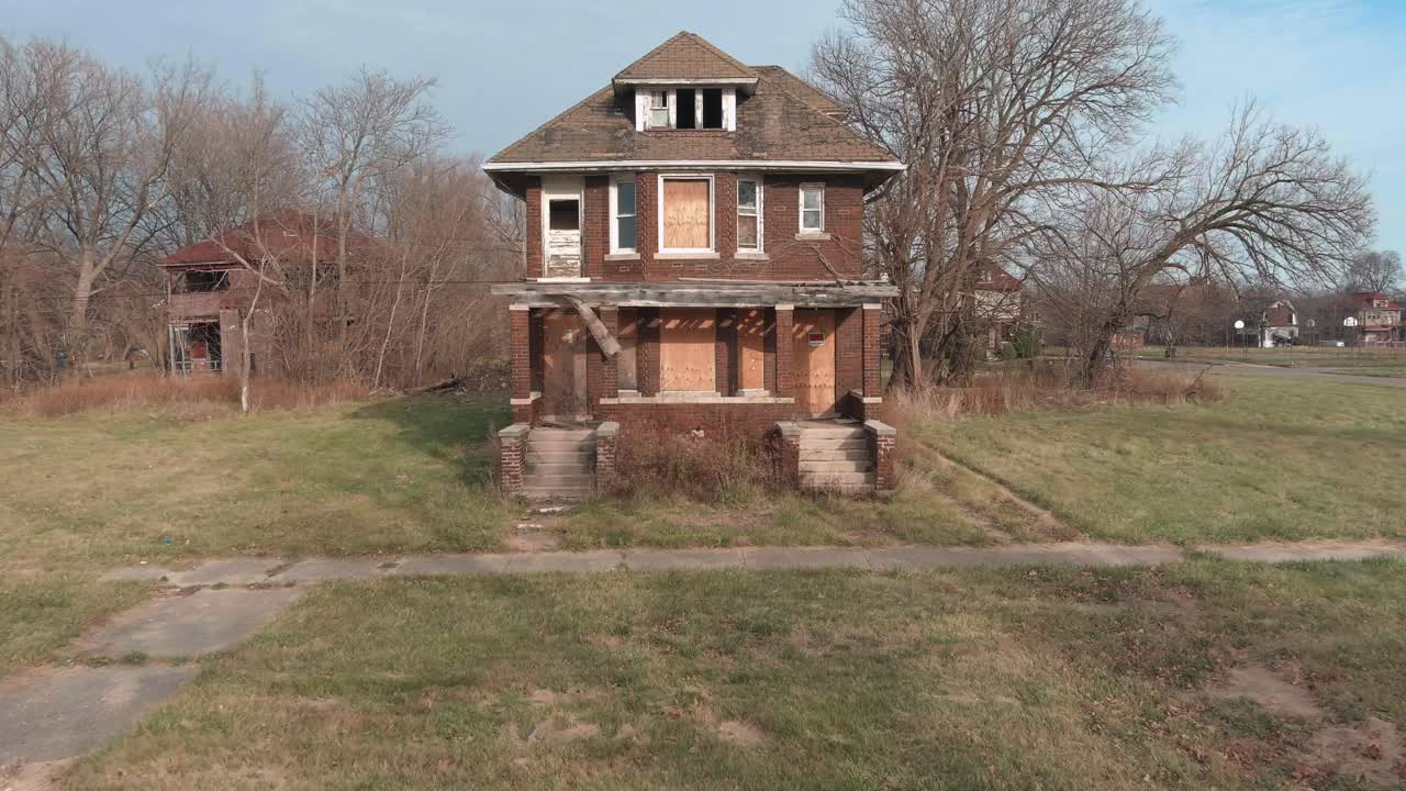 Drone view of dilapidated house in a Detroit neighborhood