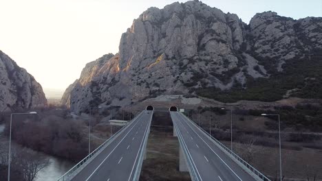 Car-driving-on-a-highway-on-a-bridge