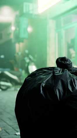 garbage bag on a street in a city