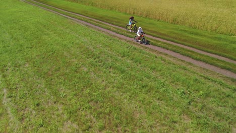 kids cycling through countryside