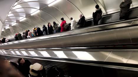 subway escalator with crowded passengers