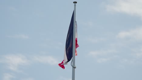 slow-motion french flag gracefully waves in the wind