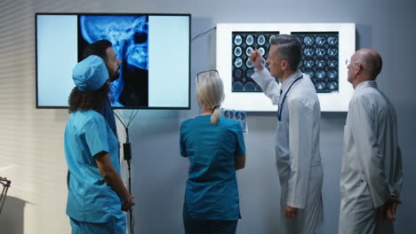 medical team reviewing x-rays