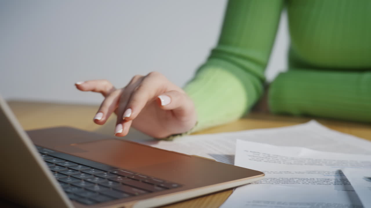 Businesswoman hands pressing laptop office closeup. Accountant using calculator