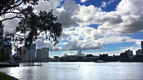 view over the brisbane river towards riverside and the story bridge in downtown brisbane, australia