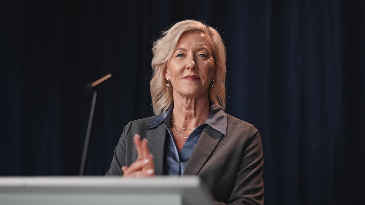 Businesswoman giving a speech at a conference
