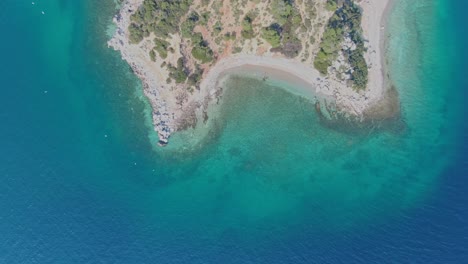 Aerial---Top-down-shot-of-Ktiponisi,-Greece-with-seagulls