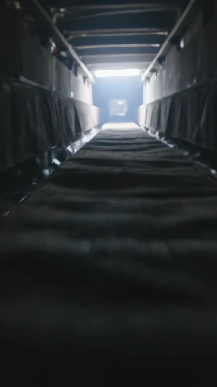 Vertical video: Starting move, low camera moving through narrow duct, showing padded sides and exit