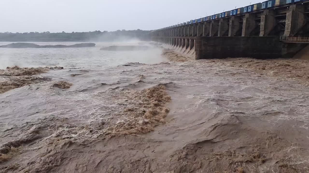 Closeup of massive discharge water from the dam of a hydroelectric plant to prevent overflow