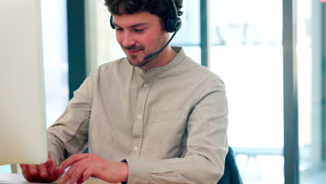 male call center agent with a headset working