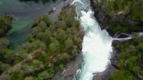 sharp turn of a stormy river in norway