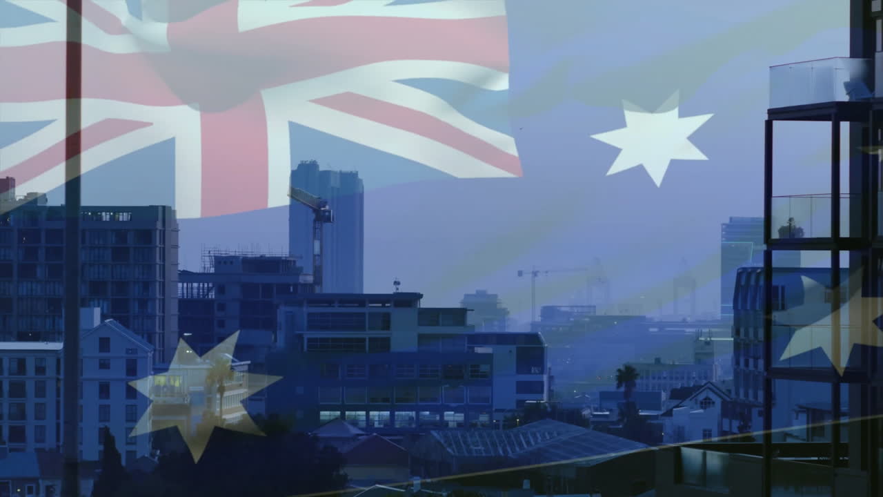 Australian flag animation over cityscape with buildings and construction cranes