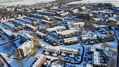 beautiful jib up of a peaceful suburban neighborhood covered in snow