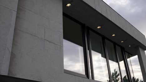 modern house exterior with stone facade and large windows