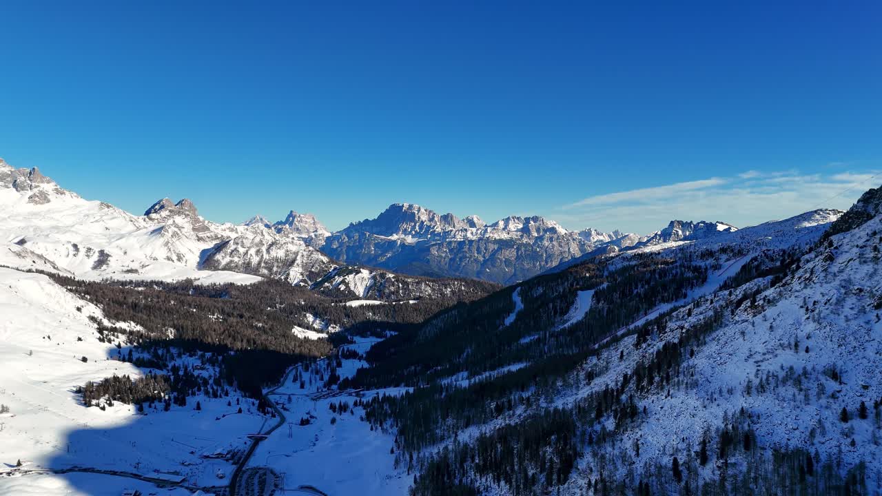 Reveal shot of rock formation in the Dolomites during winter season (drone footage)