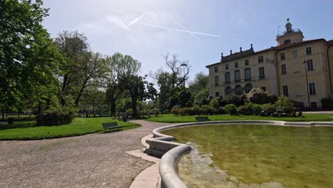 a serene walk around a park fountain