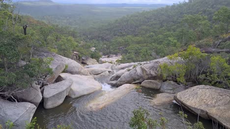 Slow-Pan-Up-From-Swimming-Hole-At-Emerald-Creek-Falls-In-Cairns