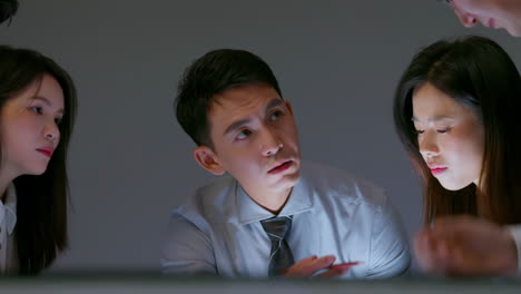 group of diverse smart attractive young business team in office building, using technology and discussing financial figures