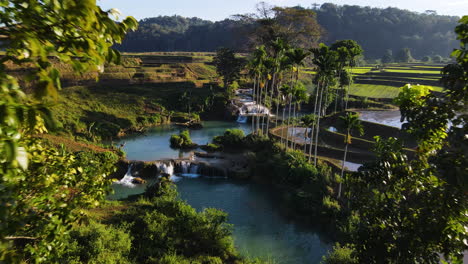 revealed exotic weekacura waterfalls near terraced rice fields in west sumba, indonesia