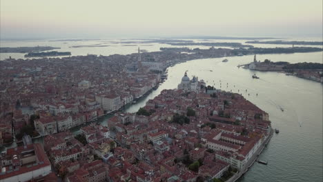 wide aerial descending shot of san marco area from above at dusk, venice, italy