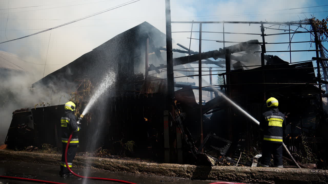 Firefighters trying to extinguish a house on fire