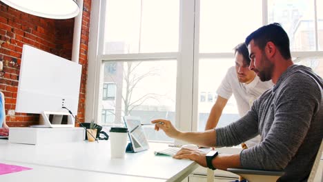 two executives discussing over digital tablet 4k