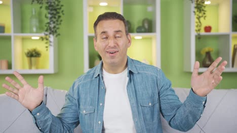 confused man looking at camera in amazement, listening, good news.