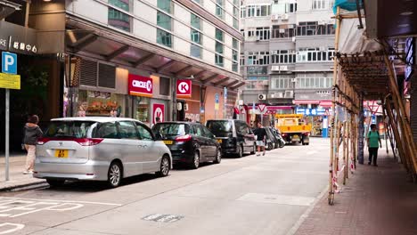 traffic and pedestrians on a bustling city street