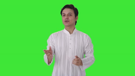 Happy-Indian-man-talking-to-someone-Green-screen