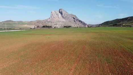 spectacular aerial flight over the enclave of peña de los enamorados, a rock formation in the shape of a human face in the municipality of antequera in andalusia, spain