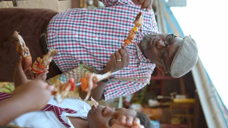 Vertical-Shot-Of-People-Having-Barbecue