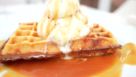 Waffle-dessert-with-Dona-Amelia-ice-cream,-caramel-drizzle