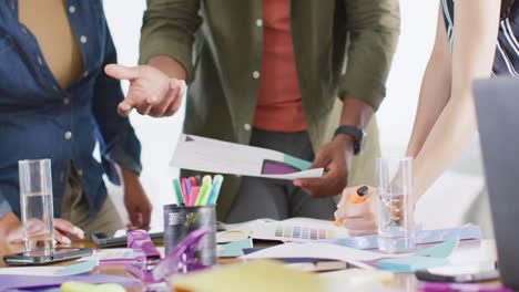 Diverse-male-and-female-friends-in-discussion-at-desk,-working-together-at-home,-in-slow-motion