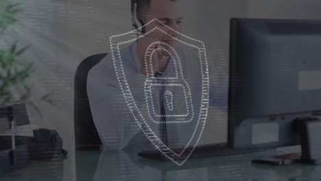 Animation-of-security-shield-and-light-over-businessman-wearing-headset