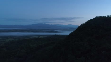 Drone-footage-of-landscape-and-mountains-during-a-sunrise