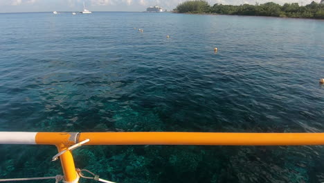 tourist-showing-ocean-POV-shot-from-a-boat-for-snorkeling-and-swimming-|-ocean-POV-shot-from-fins-on-in-feet-of-tourist