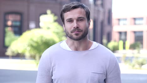 portrait of smiling handsome man looking at camera