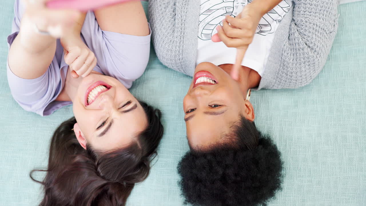 Woman, friends and selfie on bed above for social