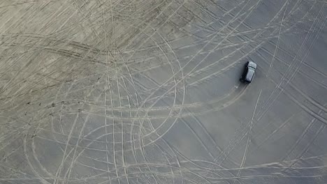 aerial shot, 4wd on the beach, bird eye view drawing on the beach