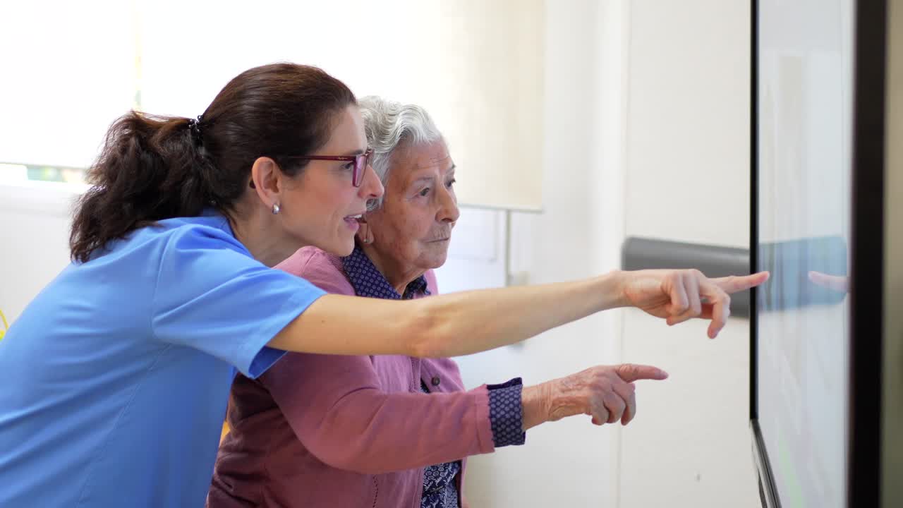 Elderly Woman Interacting with Nurse in Care Setting