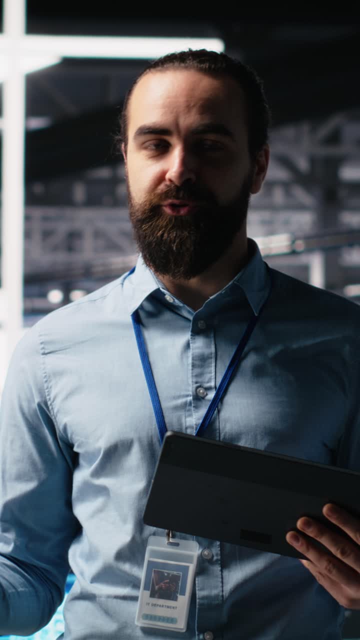 Vertical video Data center lead programmer showcasing AI technology and rigs