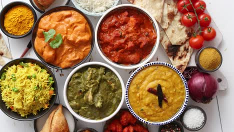 Assorted-Indian-various-food-with-spices--rice-and-fresh-vegetables