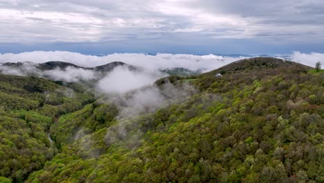 clouds and fog hang over holler near boone nc and blowing rock north carolina